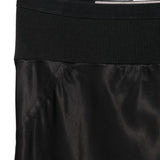 Close up of black skirt, showing texture of the cupro fabric