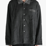 Grey shirts worn by a person, showing the shirts fit