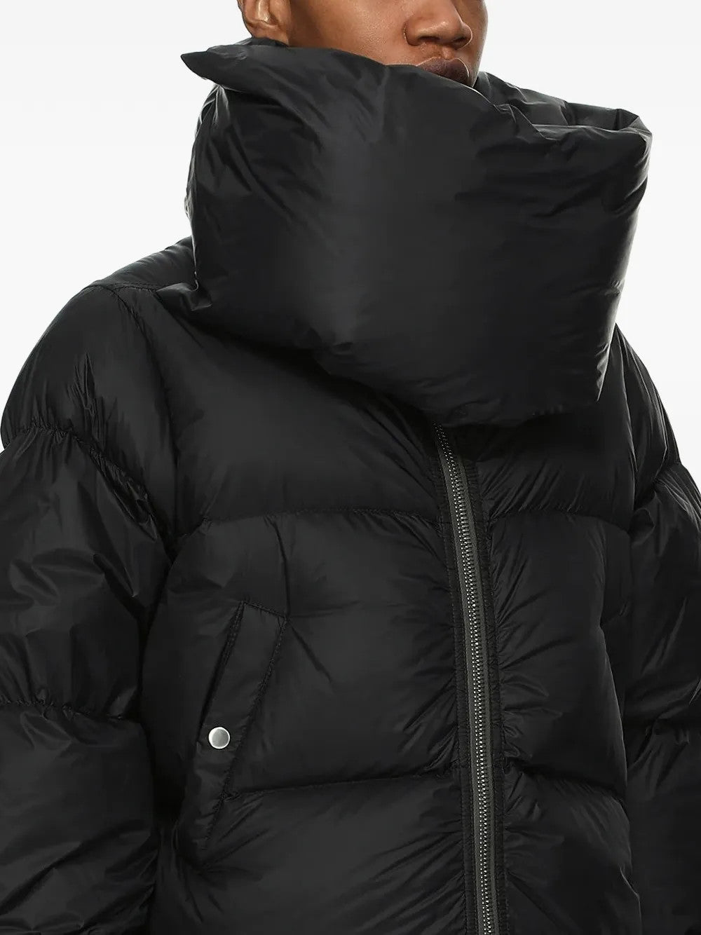 Black jacket worn by a person, showing the jacket fit