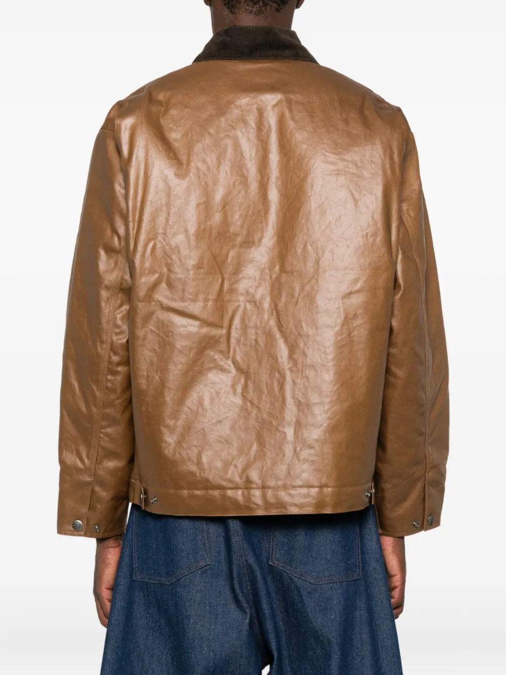 Brown jackets worn by a person, showing the jackets fit