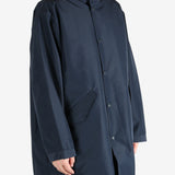 Navy jackets worn by a person, showing the jacket’s fit