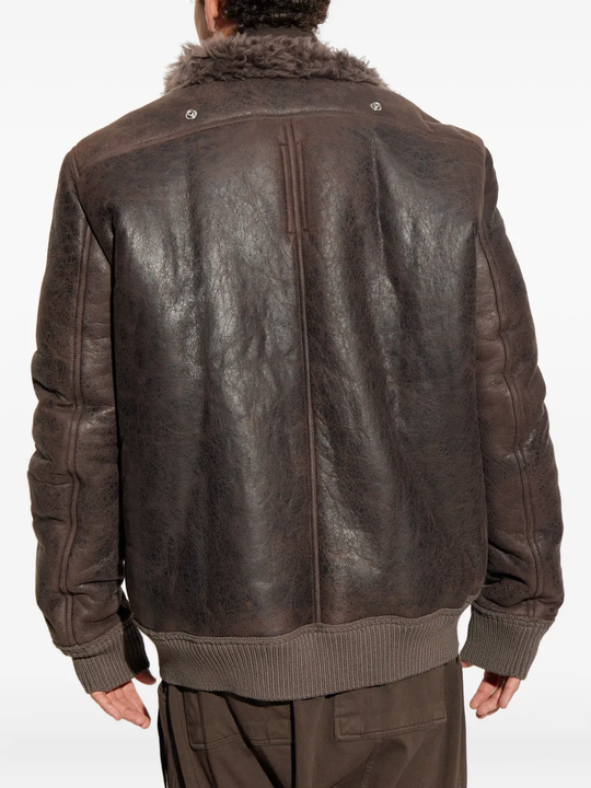 Brown jacket worn by a person, showing the jacket's fit