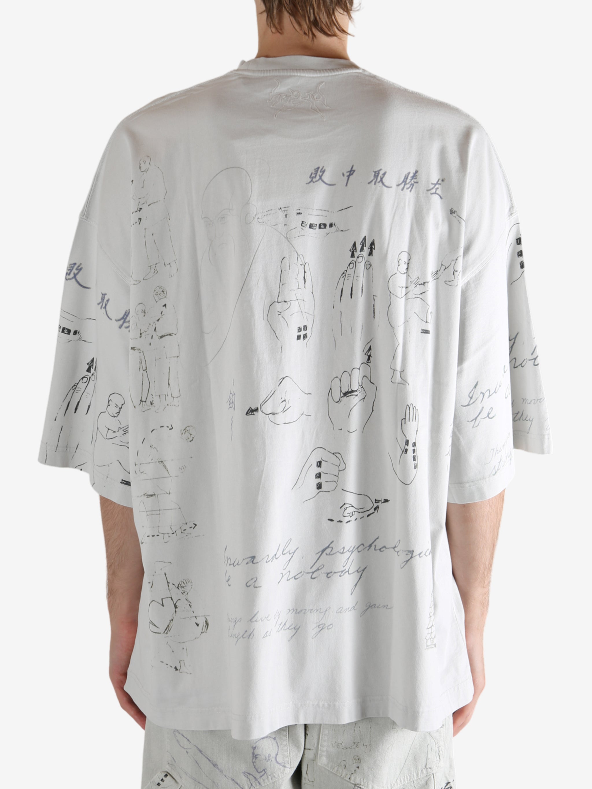 Grey T-shirt worn by a person, showing the T-shirt's fit