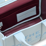 Close up of blue bag, showing texture of the calf leather fabric