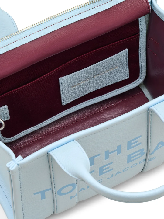 Close up of blue bag, showing texture of the calf leather fabric