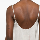 White dress worn by a person, showing the dress fit