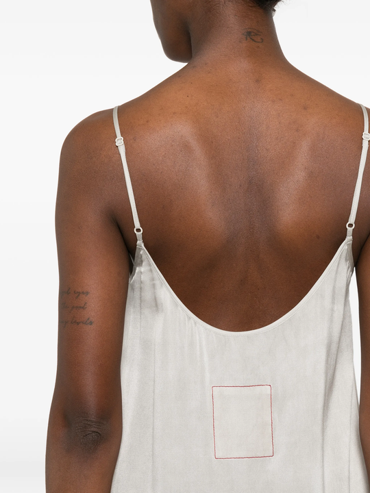 White dress worn by a person, showing the dress fit