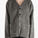 Grey cardigan worn by a person, showing the cardigan's fit