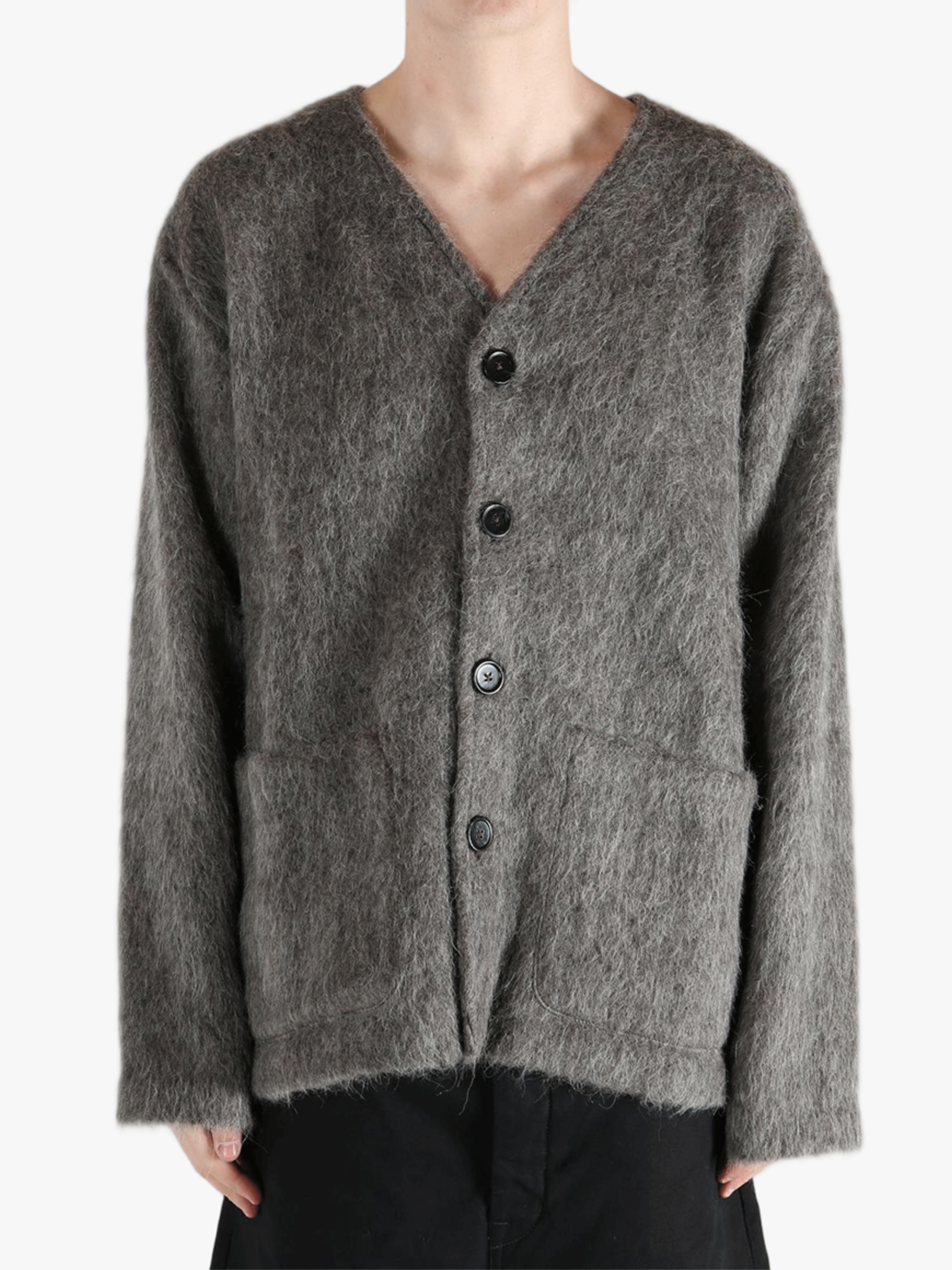 Grey cardigan worn by a person, showing the cardigan's fit