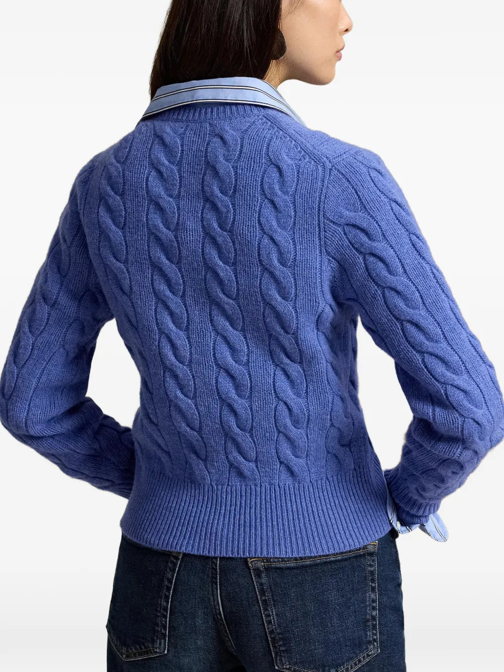 Blue knitwear worn by a person, showing the knitwear fit