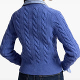 Blue knitwear worn by a person, showing the knitwear fit