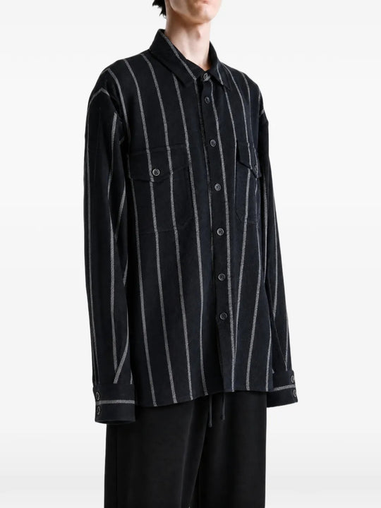 Black top worn by a person, showing the top fit
