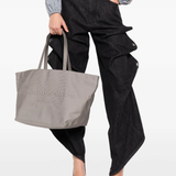 Grey bag worn by a person, showing the bag fit