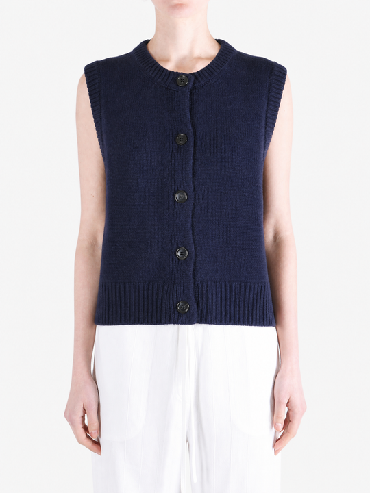 Navy top worn by a person, showing the top fit