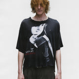 Black shirts worn by a person, showing the shirts fit