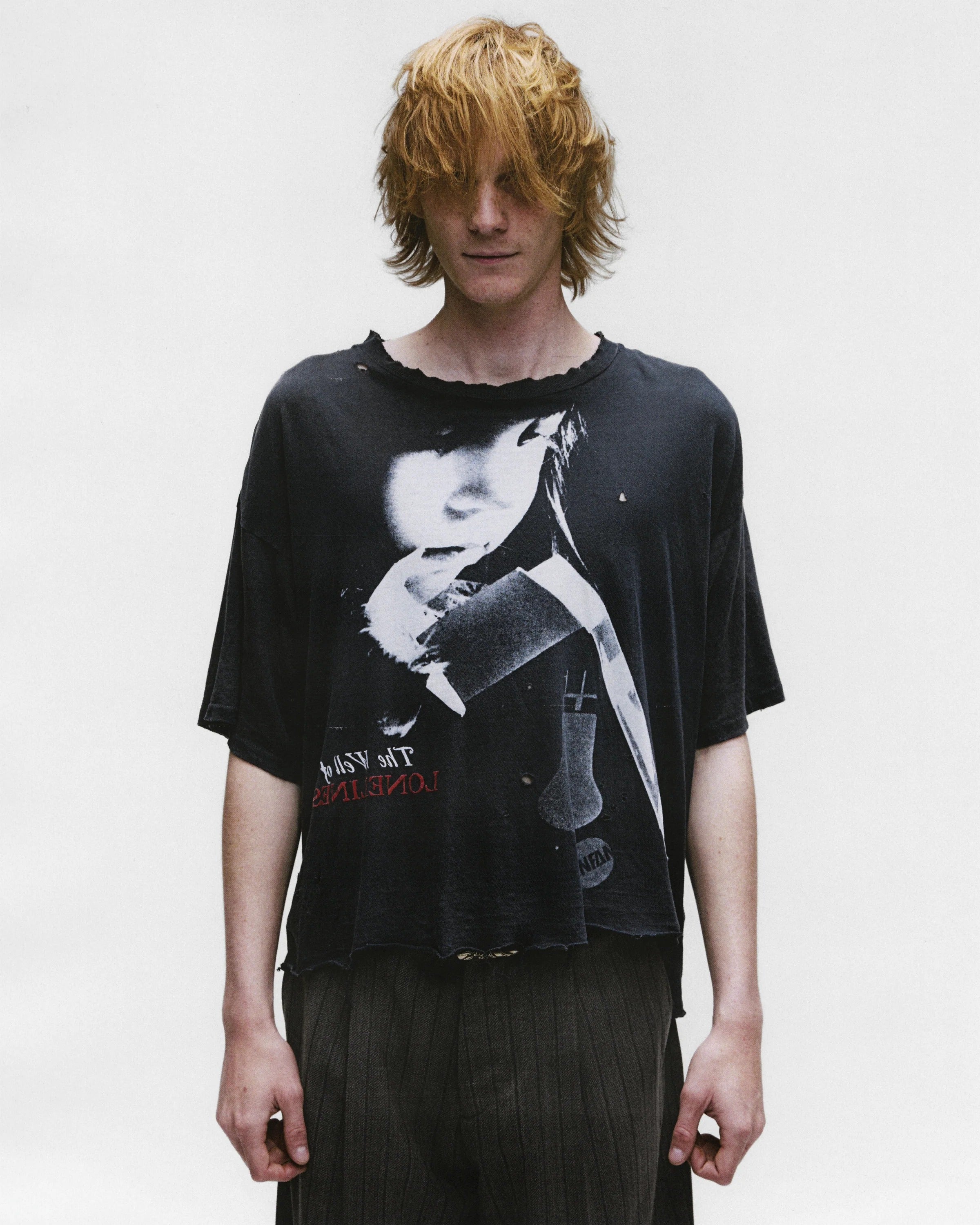 Black shirts worn by a person, showing the shirts fit