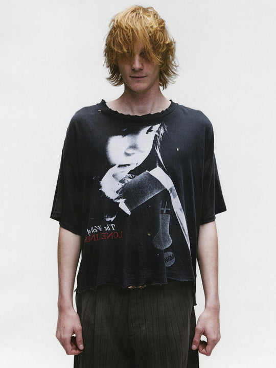 Black shirts worn by a person, showing the shirts fit