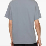 Grey shirt worn by a person, showing the shirt's fit