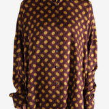 Brown shirt worn by a person, showing the shirt's fit