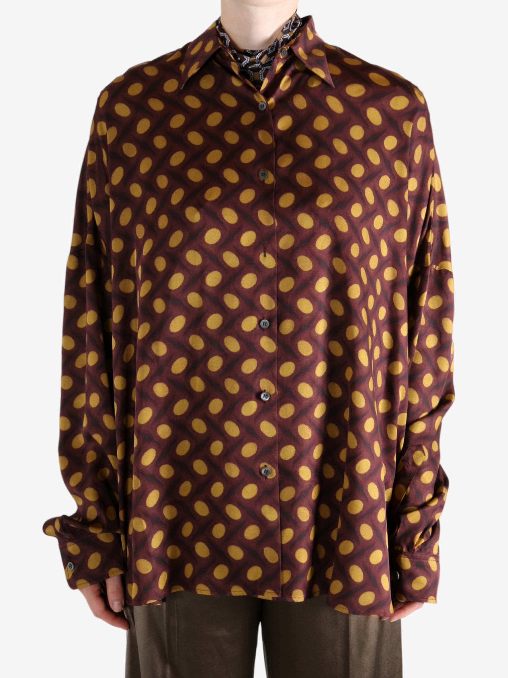 Brown shirt worn by a person, showing the shirt's fit