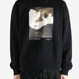 Black hoodies worn by a person, showing the hoodies fit