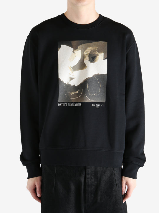 Black hoodies worn by a person, showing the hoodies fit