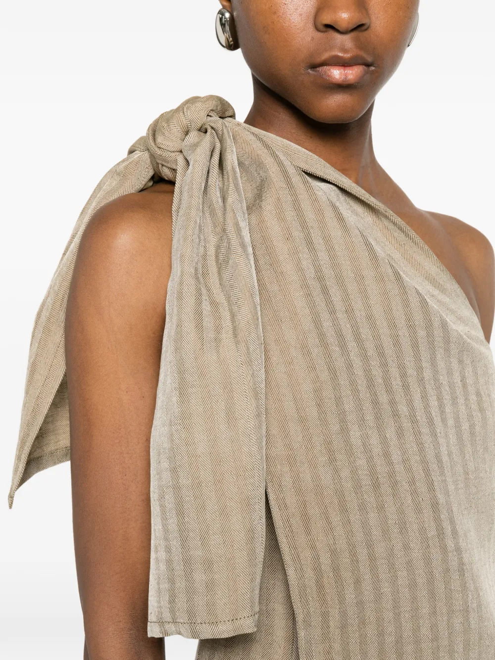 Close up of the tan jacktes, showing texture of the blended fabric
