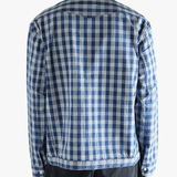 Blue shirt worn by a person, showing the shirt's fit