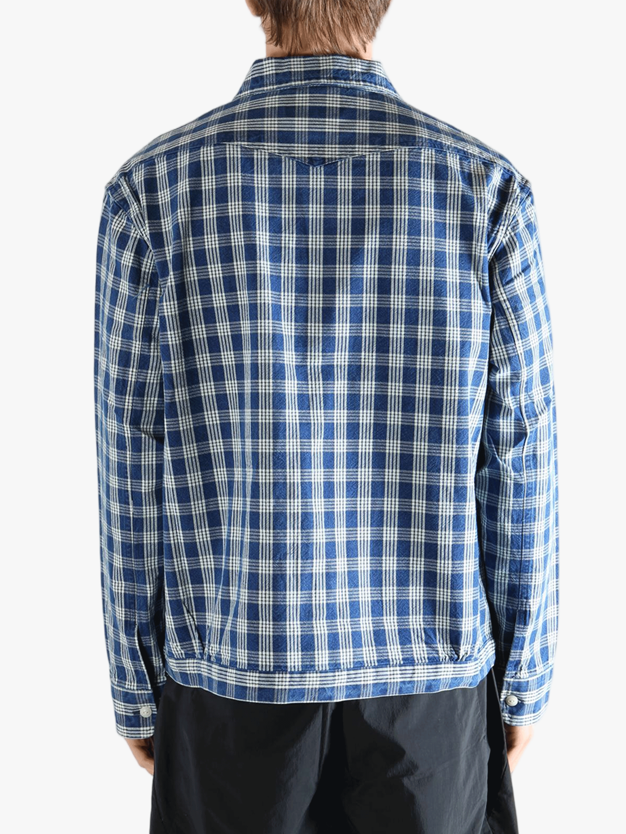 Blue shirt worn by a person, showing the shirt's fit