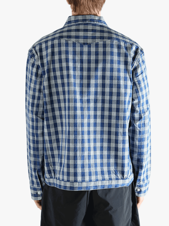 Blue shirt worn by a person, showing the shirt's fit