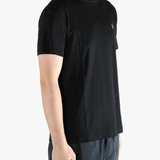 Black t-shirts worn by a person, showing the t-shirts fit