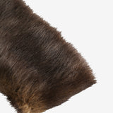 Close up of the brown hairband, showing texture of the fur fabric