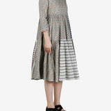 Grey dress worn by a person, showing the dress' fit