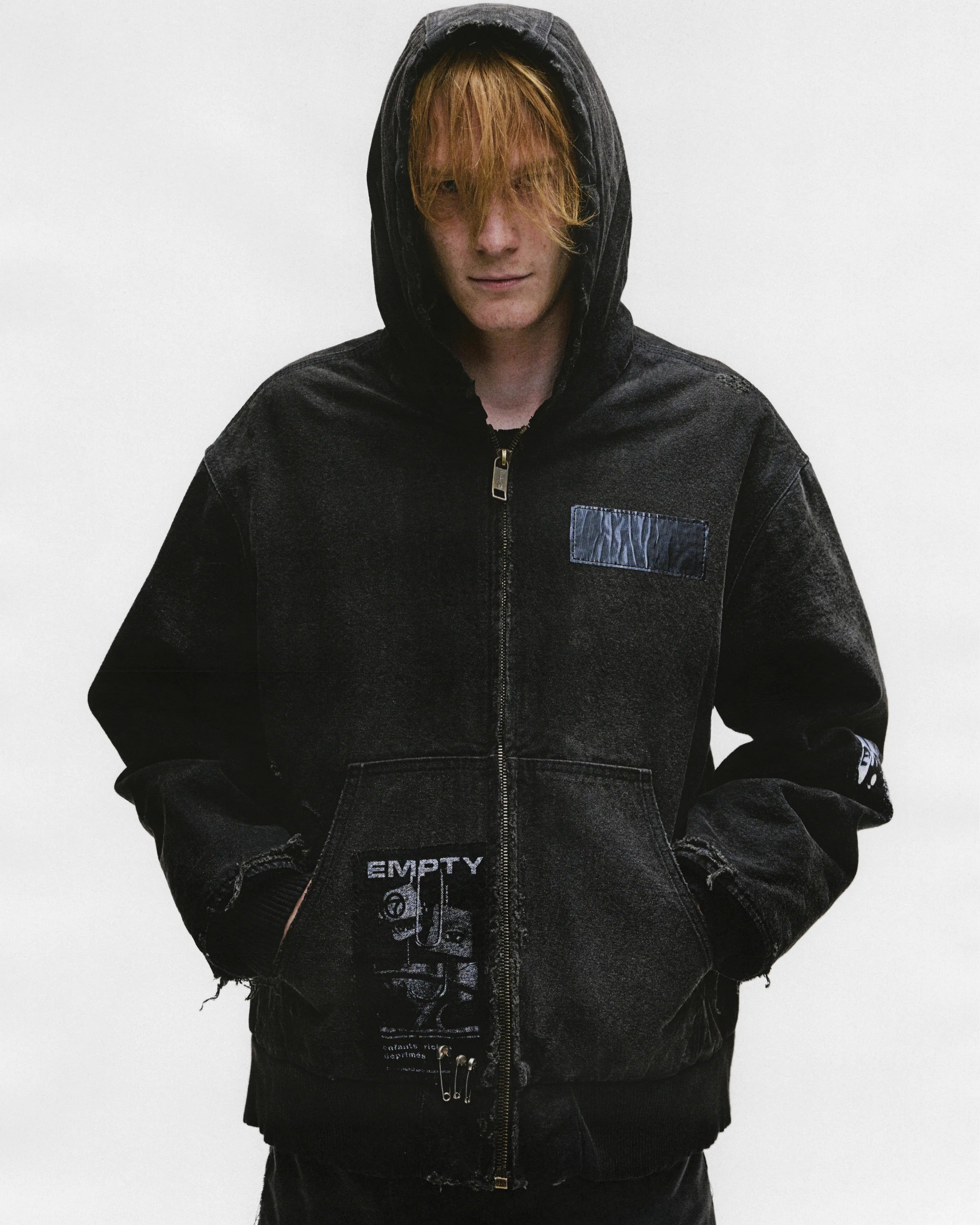 Black jacket worn by a person, showing the jacket's fit