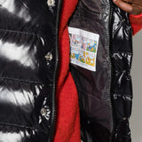 Black jacket worn by a person, showing the jacket fit
