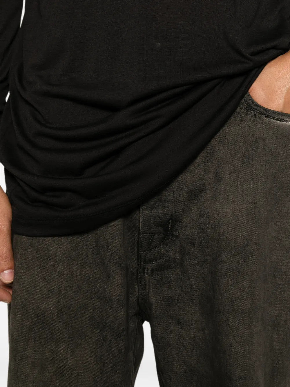 Black t-shirt worn by a person, showing the t-shirt fit
