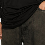 Black t-shirt worn by a person, showing the t-shirt fit