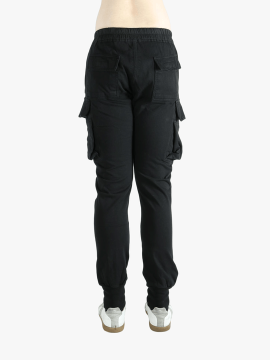 Black pants worn by a person, showing the pants fit