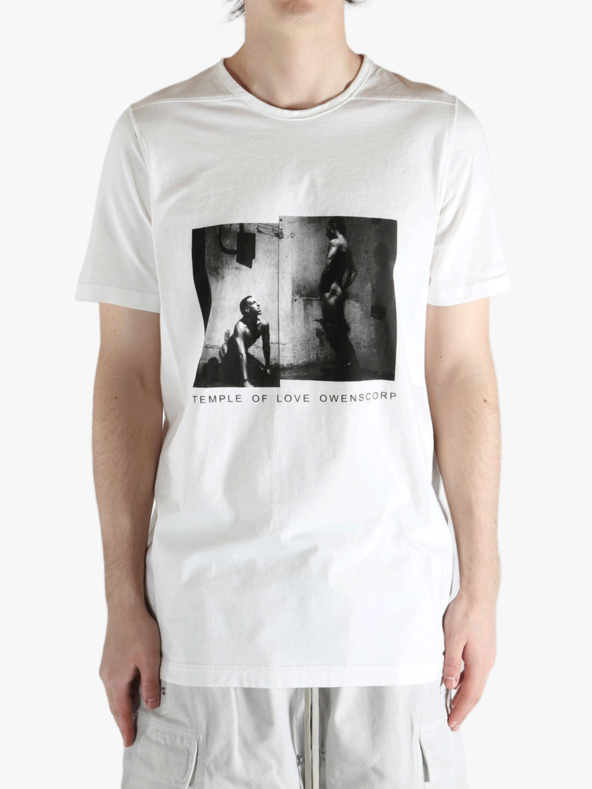 white t-shirts  worn by a person, showing the t-shirts fit