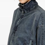 Close up of the black jacket, showing texture of the polyamide fabric