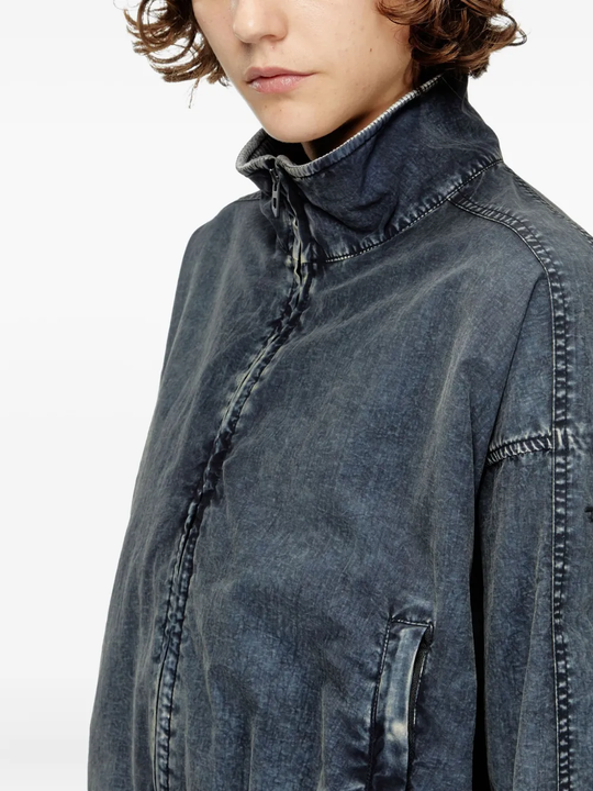 Close up of the black jacket, showing texture of the polyamide fabric