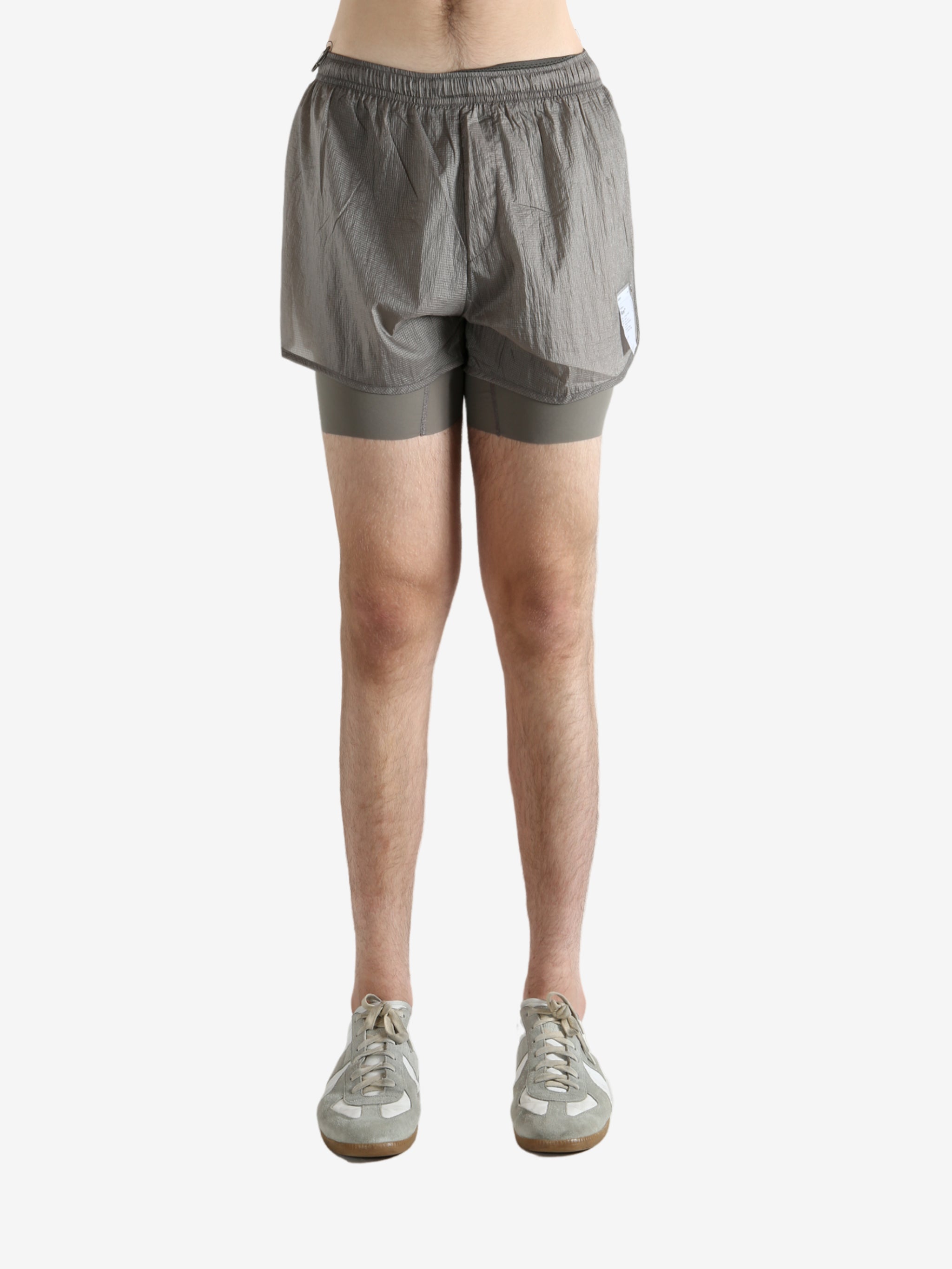 Grey shorts worn by a person, showing the shorts fit