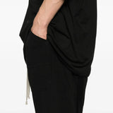 Close up of the black pants, showing texture of the cotton fabric