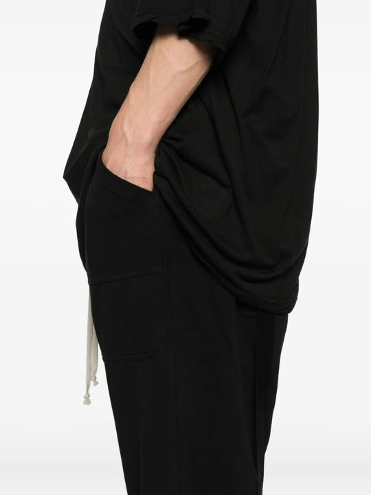 Close up of the black pants, showing texture of the cotton fabric