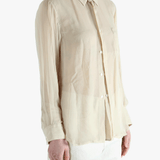 Tan shirt worn by a person, showing the shirt's fit