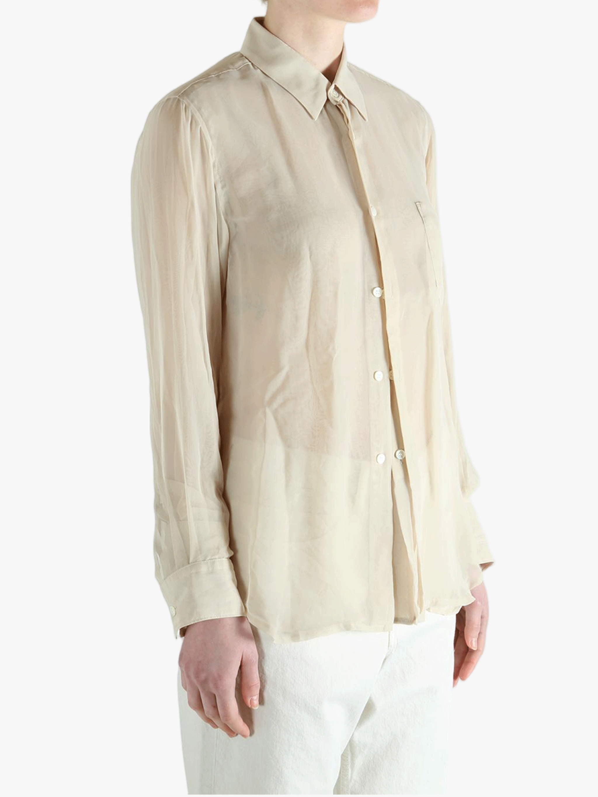 Tan shirt worn by a person, showing the shirt's fit