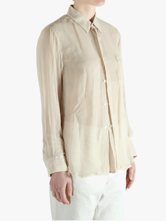Tan shirt worn by a person, showing the shirt's fit