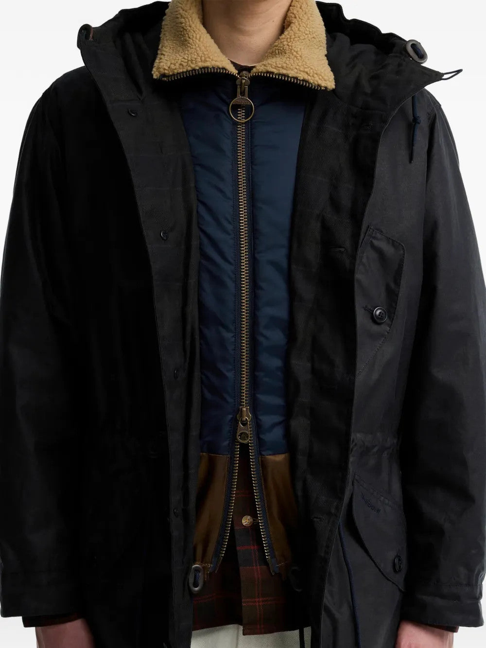 Black jacket worn by a person, showing the jacket fit
