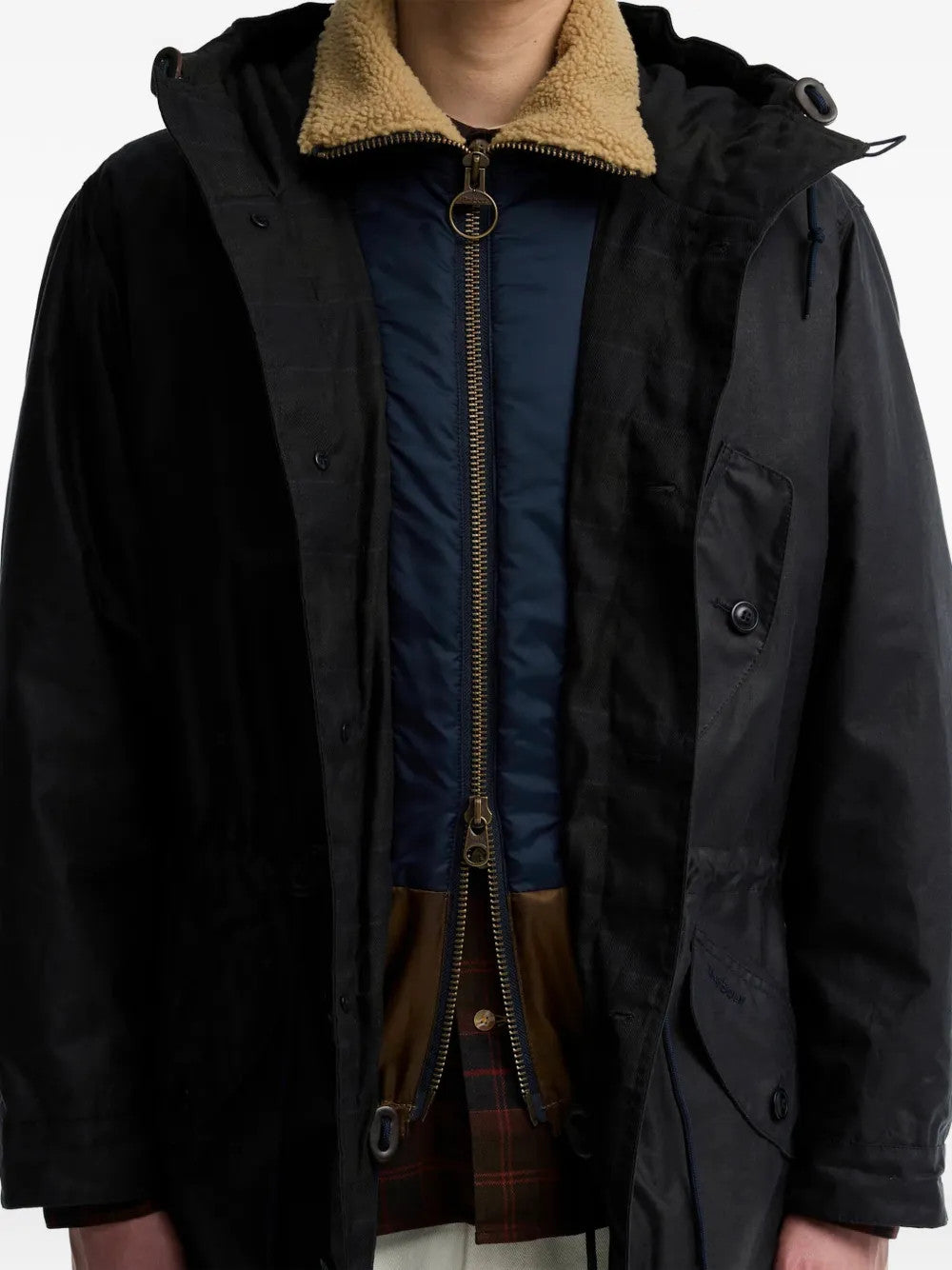 Black jacket worn by a person, showing the jacket fit