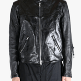 Black leather jacket worn by a person, showing the jacket fit